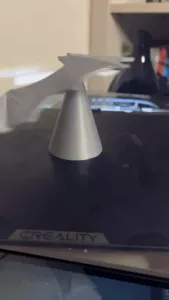 Balanced Bat standing on a tip stand