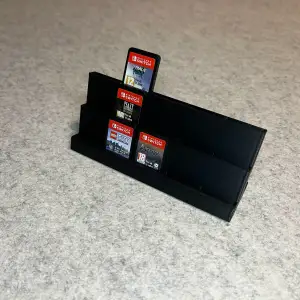Display stand holder for Nintendo Switch games