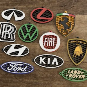 Honeycomb-style keychains with car brand logos. part3