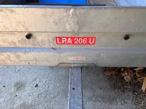 Tarpaulin holder for car trailer