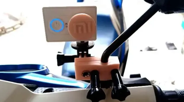 Mount for action camera on the rearview mirror