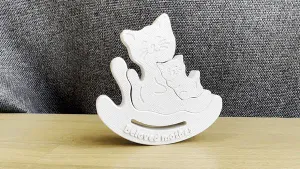 Mom cat and kitten in a chair