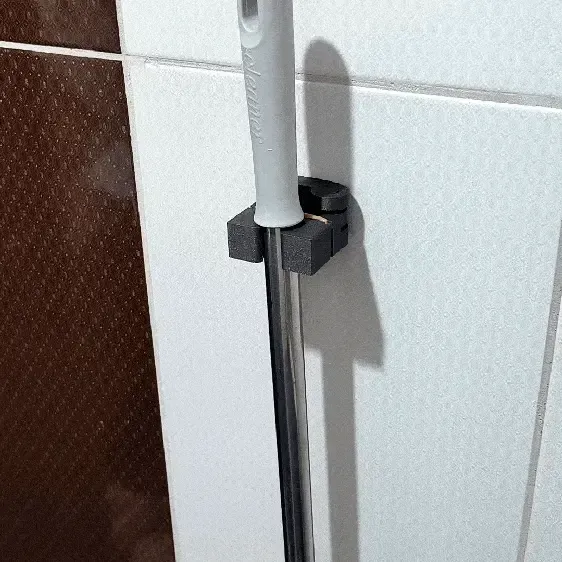 WALL-MOUNTED MOP/BROOM HOLDER