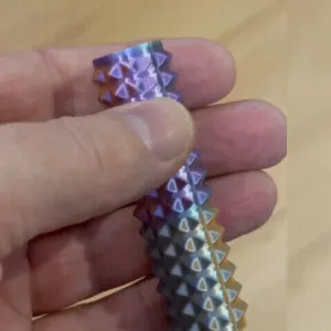 Sensory stim roller, compact hand sized spiked fidget toy
