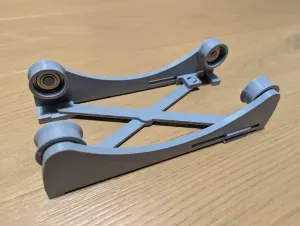 Adjustable width filament spool roller