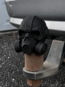 Gas mask-shaped tow hitch cover