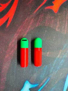 Capsule-shaped container in two sizes.