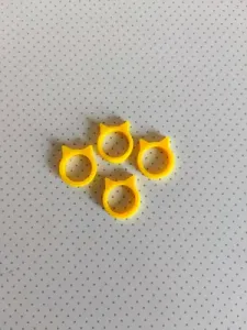 A ring in the shape of a cat's face with ears