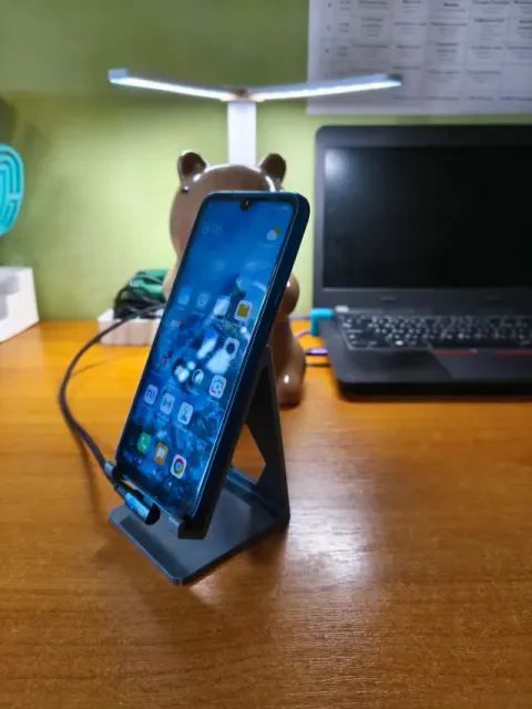 Phone stand for side charging cable